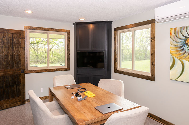 Conference Room with large wooden desk and chairs